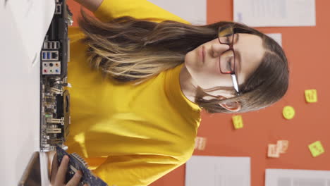 Vertical-video-of-Thoughtful-girl-child-focused-on-tech-stuff.